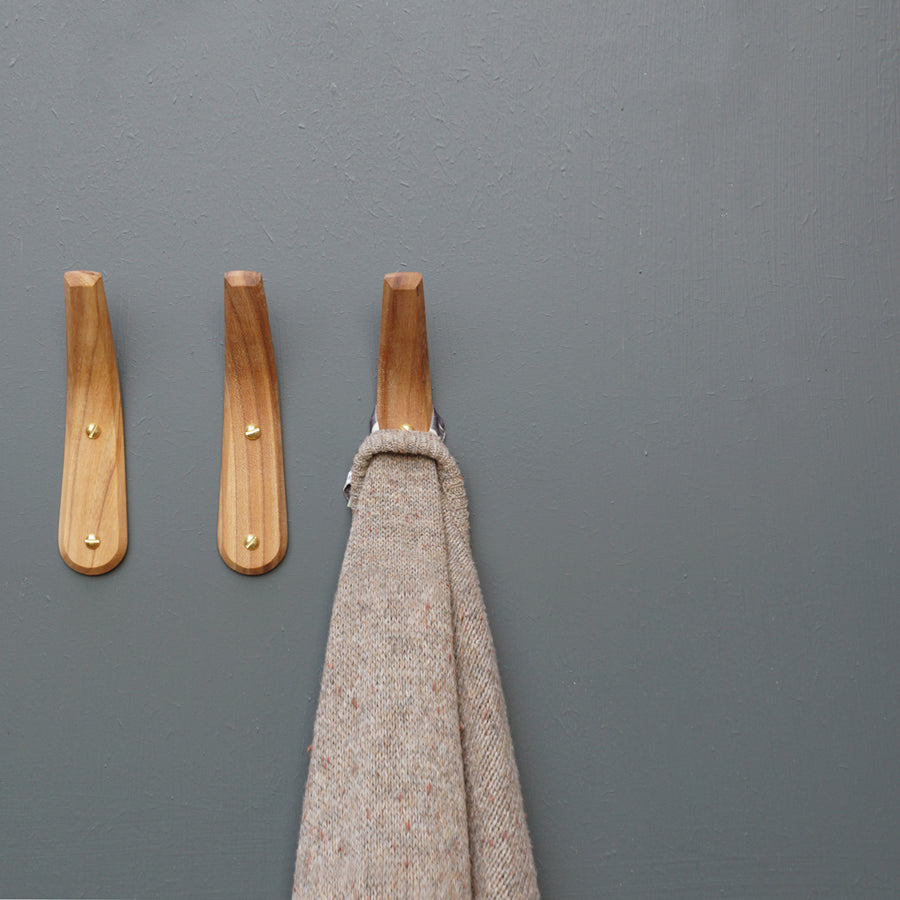 Wall mounted coat hooks. LayerTree.