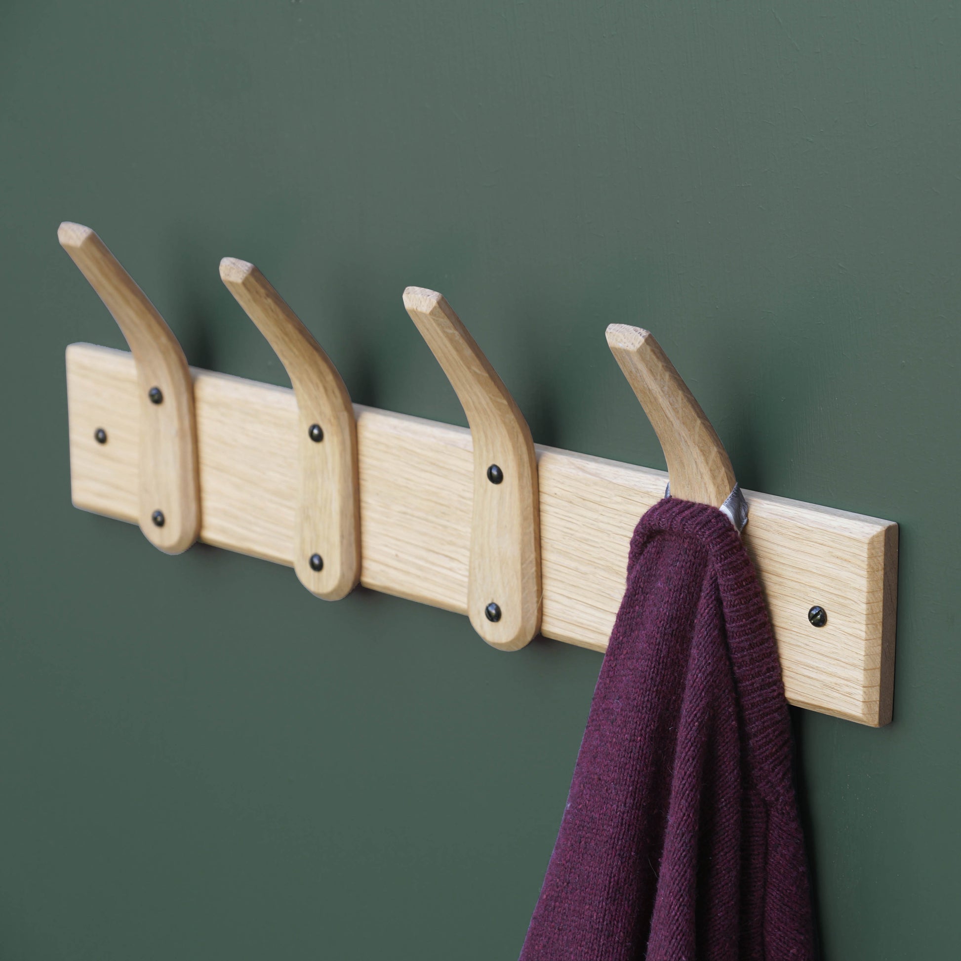 Wooden wall mounted coat rack. LayerTree.